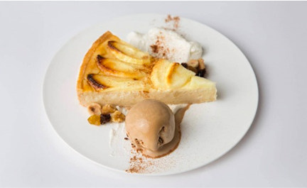 Apple tart with cream, ice cream and dried fruit and nuts